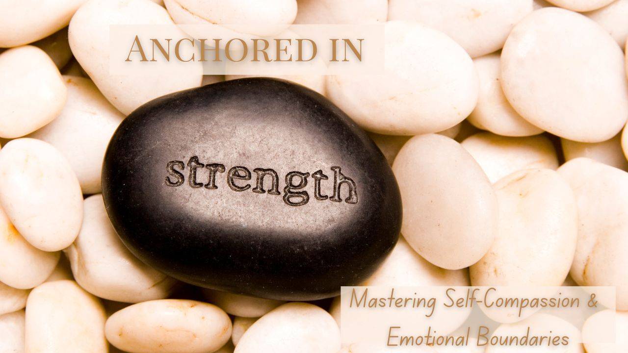 A smooth dark stone engraved with the word strength, resting on a bed of pale pebbles